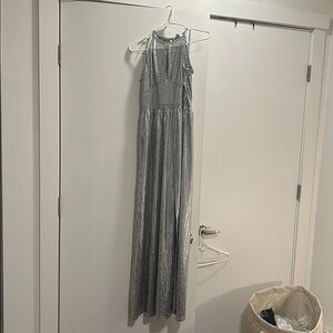 Michael Kors, metallic silver maxi dress with a slit.